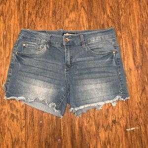 Blue denim shorts.